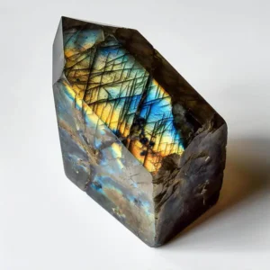 Labradorite stone with shimmering iridescent flashes of blue and green.