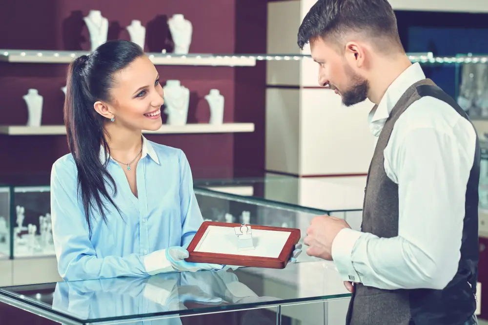 A women selling jewelry to person