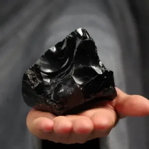 Shiny black Obsidian stone with a smooth, polished surface.