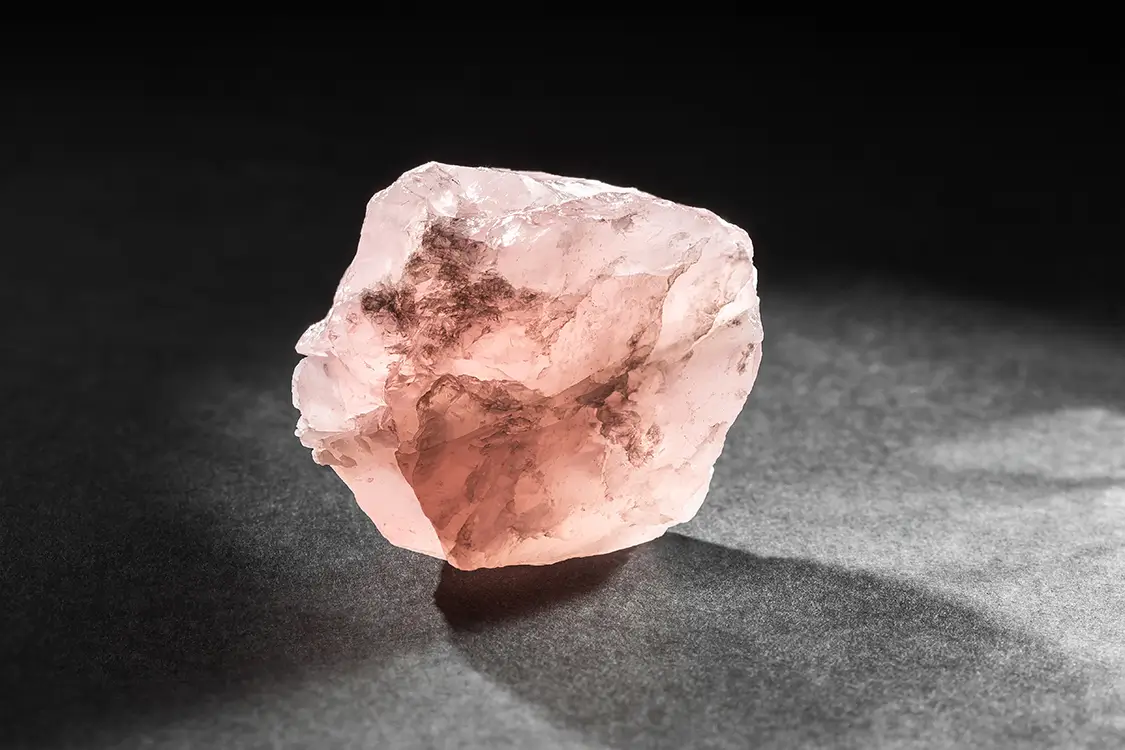 "Unpolished raw Morganite crystal with a natural pink color