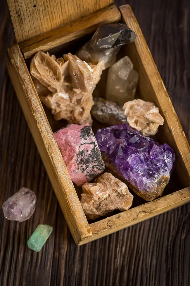 A Wooden Box full of Raw Gem Stones